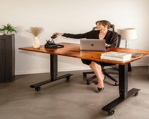 person stretching at modern office desk